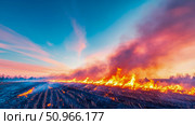 Dramatic landscape of fire engulfing a field at sunset. Стоковое AI-изображение, AI-художник Данила Большаков / Фотобанк Лори