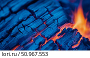 Mystical Vibrant Blue Charcoal Embers Ignited by Fiery Orange Flame, a Dynamic Abstract Energy Concept for Artistic Creation and Background Use. Стоковое AI-изображение, AI-художник Данила Большаков / Фотобанк Лори