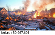 Catastrophic residential conflagration: houses in intense flames and thick smoke, debris scattered across the ground, a scene of immense destruction and loss. Стоковое AI-изображение, AI-художник Данила Большаков / Фотобанк Лори