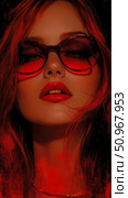 A fiery modern portrait showcasing a woman's enigmatic presence with bold red lips and striking red-tinted eyewear, digital artwork for print, card, poster. Стоковое AI-изображение, AI-художник Данила Большаков / Фотобанк Лори