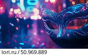 Enigmatic glitter-adorned masquerade mask in vibrant blue and pink tones, set against a backdrop of blurred neon lights and floating confetti, evoking a lively night celebration. Стоковое AI-изображение, AI-художник Данила Большаков / Фотобанк Лори