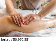 Natural medicine, reflexology, woman getting calf massage, depressing energy points, spa center, calm interior. Стоковое фото, фотограф Владислав Тригуб / Фотобанк Лори
