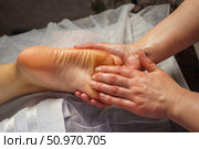 Natural medicine, reflexology, woman receiving foot massage, oppresses energy flow points, spa center calm interior, Стоковое фото, фотограф Владислав Тригуб / Фотобанк Лори