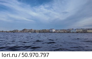 View of the waterfront buildings against a dramatic sky in a coastal city - Saint Petersburg, Russia, July 14, 2025. Стоковое видео, видеограф Наталия Попова / Фотобанк Лори