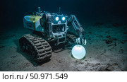 A deep-sea mining robot operates on the ocean floor. Стоковое AI-изображение, AI-художник Евгения Пархоменко / Фотобанк Лори