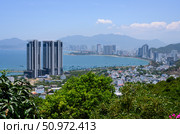 NHA TRANG, VIETNAM - APRIL 28, 2025. View from the mountain to the city with skyscrapers on the shore of the Gulf of the South China Sea. Редакционное фото, фотограф Сергей Фролов / Фотобанк Лори