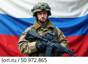 Image of a soldier of the Russian army with full equipment on the background of the Russian flag. Стоковое AI-изображение, AI-художник ketpro.design / Фотобанк Лори