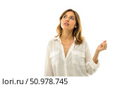 Portrait of young female with brown eyes and natural makeup holding hand to forehead looking lost in thought trying to recall forgotten information dressed in white loose top isolated on white. Стоковое AI-изображение, AI-художник Павел Муравьев / Фотобанк Лори