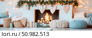 Cozy Christmas Fireplace Scene: White Brick Mantel, Knitted Hearts, and Warm Firelight. Стоковое AI-изображение, AI-художник Данила Большаков / Фотобанк Лори
