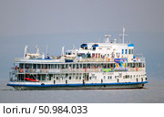 Russia, Samara. 17. 08 2014. The ship Pyotr Alabin makes a cruise along the Volga River on a sunny summer day. Text in Russian: Pyotr Alabin. Редакционное фото, фотограф Акиньшин Владимир / Фотобанк Лори
