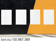 geometrical wall and four white glued wrinkled poster templates. Стоковое фото, фотограф Александра Конопля / Фотобанк Лори