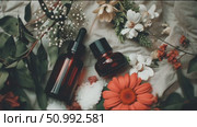 Natural beauty essentials displayed with fresh flowers and aromatic salt on a soft background in a serene setting. Стоковое AI-видео, аниматор Сергей Толмачёв / Фотобанк Лори