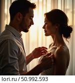 In a serene setting illuminated by the warm glow of the sunset, a man and a woman share a tender moment Generative AI. Стоковое AI-изображение, AI-художник Юлия Петровская / Фотобанк Лори