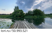 Summer evening in the village on the river. Стоковое видео, видеограф Соболева Наталия / Фотобанк Лори