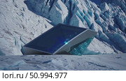 Futuristic glass monolith leaning against snowy glacier backdrop, emitting blue luminescence, highlighting technological innovation against pristine natural landscape. Стоковое AI-видео, аниматор Данил Руденко / Фотобанк Лори