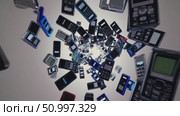 Vintage mobile phones swirling in blue, black, red tones against gray background, representing technological transformation and communication design nostalgia. Стоковое AI-видео, аниматор Данил Руденко / Фотобанк Лори