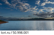Beautiful calm lake. Evening landscape. Ripples, reflections on the surface of the water. Hills on the horizon. Blue sky, clouds. Madagascar. Lake Mantasoa. Стоковое фото, фотограф Вера Ивановна Кубарева / Фотобанк Лори