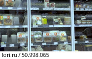 A Display of Freshly Packaged Meals Ready for Selection in a Modern Refrigerator, Showcasing a Variety of Convenient and Healthy Dining Options for Busy Individuals. Стоковое видео, видеограф Владимир Федоров / Фотобанк Лори