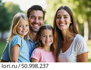 Amid a vibrant green park, a loving family stands together, radiating happiness. The parents flank their two daughters, creating precious memories on a sunny day filled with warmth Generative AI. Стоковое AI-изображение, AI-художник Юлия Петровская / Фотобанк Лори