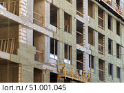 Installation of external wall thermal insulation with rock wool. Exterior passive house wall heat insulation with mineral wool. Insulation facade of multistory residential building. Energy efficiency. Стоковое фото, фотограф Данила Большаков / Фотобанк Лори