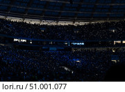 People with lights in darkness. Crowd of unrecognizable music fans waving mobile flashlights at the concert at stadium. Стоковое фото, фотограф Данила Большаков / Фотобанк Лори