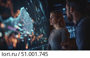 Experts analyze data trends in a modern workspace during a strategic planning session. Стоковое AI-видео, аниматор Сергей Толмачёв / Фотобанк Лори