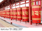 Elista, capital of Republic of Kalmykia, Russia, July, 4, 2025: Prayer drums of khurul, Buddhist temple Golden Abode of Buddha Shakyamuni, largest Buddhist temple in Europe. Редакционное фото, фотограф Екатерина Топорова / Фотобанк Лори