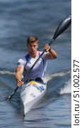 Professional kayaker paddling energetically on calm water. Стоковое AI-видео, аниматор Юрий Поздников / Фотобанк Лори