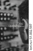 Sound engineer listening to music with in ear headphones. Стоковое AI-видео, аниматор Юрий Поздников / Фотобанк Лори
