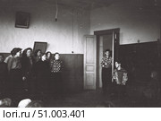 Концерт самодеятельности в деревенской школе, 1950-е годы. Хор девушек и молодой человек играющий на баяне. Стоковое фото, фотограф Retro / Фотобанк Лори