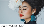 Woman with vibrant makeup and floral decoration showcases elegance in a beauty shoot. Стоковое AI-видео, аниматор Сергей Толмачёв / Фотобанк Лори