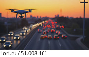 A drone hovers above a busy highway, highlighting the vibrant flow of vehicles as the sun sets in the background, creating a stunning visual contrast. Стоковое AI-видео, аниматор Данила Большаков / Фотобанк Лори