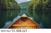 A tranquil journey unfolds as a wooden boat navigates still waters, embraced by vibrant green hills and overcast skies. Стоковое AI-видео, аниматор Данила Большаков / Фотобанк Лори