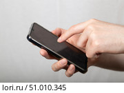 Phone fraud.Talking to phone scammers. Withdrawal of money via the Internet. Стоковое фото, фотограф Александр Поташев / Фотобанк Лори