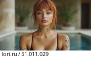 Discover a tranquil poolside atmosphere featuring a model with striking tattoos while enjoying a sunny day in a beautiful outdoor setting. Стоковое AI-видео, аниматор Данила Большаков / Фотобанк Лори