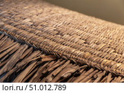 Close-Up of a Woven Thatch Surface Displaying Detailed Craftsmanship. Стоковое фото, фотограф EugeneSergeev / Фотобанк Лори