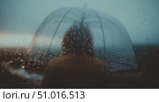 Umbrella shields against rain while person watches the horizon at dusk. Стоковое AI-видео, аниматор Сергей Толмачёв / Фотобанк Лори