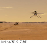 Artist's concept of Mars Ingenuity drone flying above the Perseverance rover on planet Mars. Стоковое фото, фотограф Stocktrek Images, Inc. / ТАСС / Фотобанк Лори