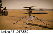 Artist's concept of the Ingenuity Mars helicopter on the Red Planet's surface. Стоковое фото, фотограф Stocktrek Images, Inc. / ТАСС / Фотобанк Лори