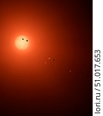 Artist's concept of the seven TRAPPIST-1 planets orbiting their Sun. Стоковое фото, фотограф Stocktrek Images, Inc. / ТАСС / Фотобанк Лори