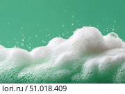Beauty Product Foam Soap. Abstract background white soapy foam flowing texture. Shampoo foam with bubbles. Bubble surface isolated on a green color. Chroma key. Suds. Facial cleanser. Froth Pattern. Стоковое AI-изображение, AI-художник Марина Демидюк / Фотобанк Лори