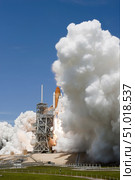 An exhaust plume forms around the base of Launch Pad 39A as space shuttle Atlantis lifts off on the STS-132 mission. Стоковое фото, фотограф Stocktrek Images, Inc. / ТАСС / Фотобанк Лори
