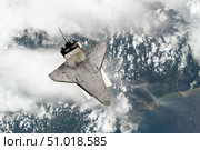 The underside of space shuttle Discovery as the shuttle approaches the International Space Station. Стоковое фото, фотограф Stocktrek Images, Inc. / ТАСС / Фотобанк Лори