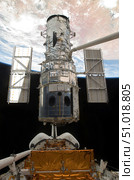 The Hubble Space Telescope is released from the cargo bay of Space Shuttle Atlantis. Стоковое фото, фотограф Stocktrek Images, Inc. / ТАСС / Фотобанк Лори