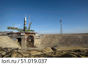 The Soyuz rocket is erected into position at the launch pad at the Baikonur Cosmodrome in Kazakhstan (2009 год). Стоковое фото, фотограф Stocktrek Images, Inc. / ТАСС / Фотобанк Лори