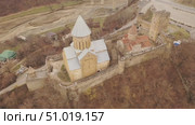 Aerial view of the medieval fortess of of Ananuri, located between the Zhinvali reservoir and the Georgian Military Road. Стоковое видео, видеограф Яков Филимонов / Фотобанк Лори