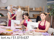 Woman and girl tailors sewing, senior female designer work with mannequin. Стоковое фото, фотограф Яков Филимонов / Фотобанк Лори