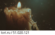 Candle flame flickers while wax drips in a dark atmosphere creating a calming ambiance. Стоковое AI-видео, аниматор Сергей Толмачёв / Фотобанк Лори
