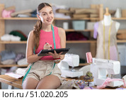 Woman designer use stylus to draw on graphics tablet. Стоковое фото, фотограф Яков Филимонов / Фотобанк Лори