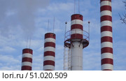 Boiler room chimneys against blue sky background. Стоковое видео, видеограф Igor Skripachev / Фотобанк Лори